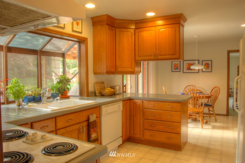 18731 129th Court Northeast Bothell, WA 98011 - Photo 10 of 24 a kitchen with a sink and a cabinets