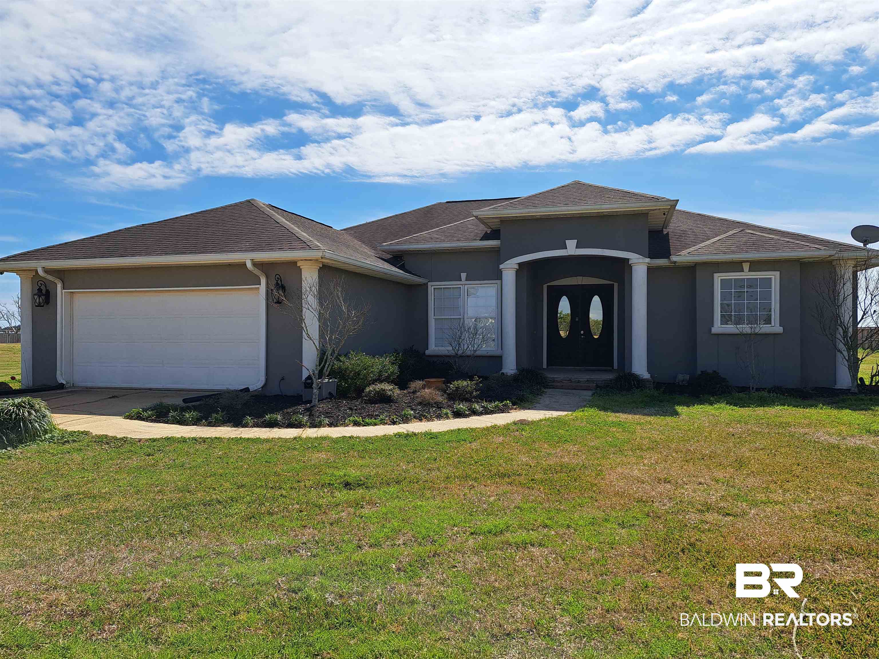 10332 Hartung Road Foley, AL 36535 - Photo 4 of 41 View of front of property featuring a garage and a front yard