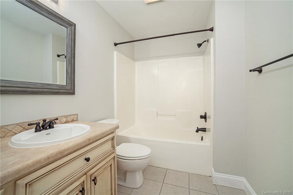 5415 Unionville Road Monroe, NC 28110 - Photo 16 of 40 a bathroom with a sink toilet and shower