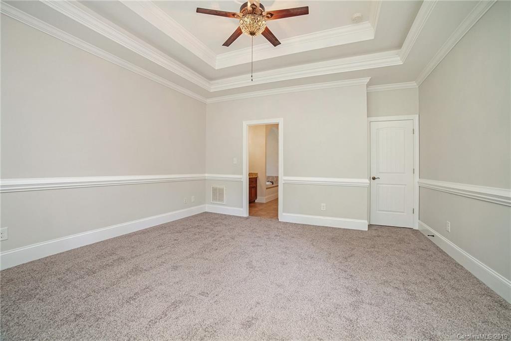 5415 Unionville Road Monroe, NC 28110 - Photo 25 of 40 an empty room with closet and a ceiling fan