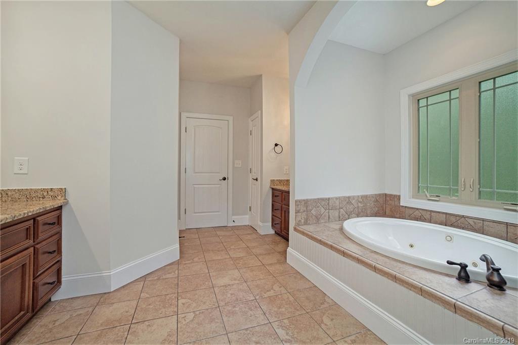 5415 Unionville Road Monroe, NC 28110 - Photo 27 of 40 a bathroom with a tub and shower