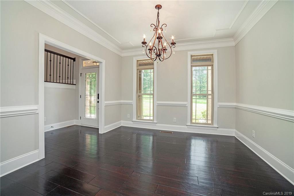 5415 Unionville Road Monroe, NC 28110 - Photo 4 of 40 a view of an empty room with wooden floor and a window