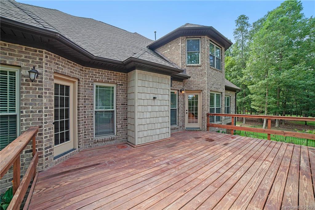 5415 Unionville Road Monroe, NC 28110 - Photo 33 of 40 a view of house with deck and wooden floor
