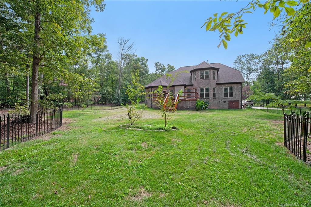 5415 Unionville Road Monroe, NC 28110 - Photo 34 of 40 a view of a house with a yard and a tree