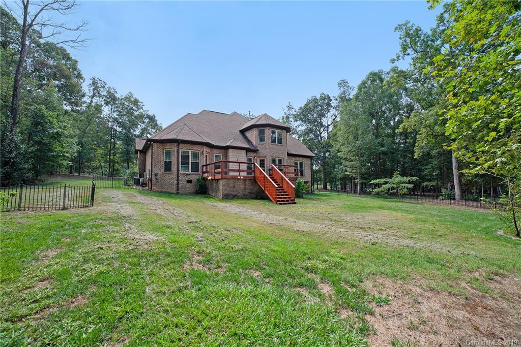 5415 Unionville Road Monroe, NC 28110 - Photo 35 of 40 a view of a house with backyard and a tree