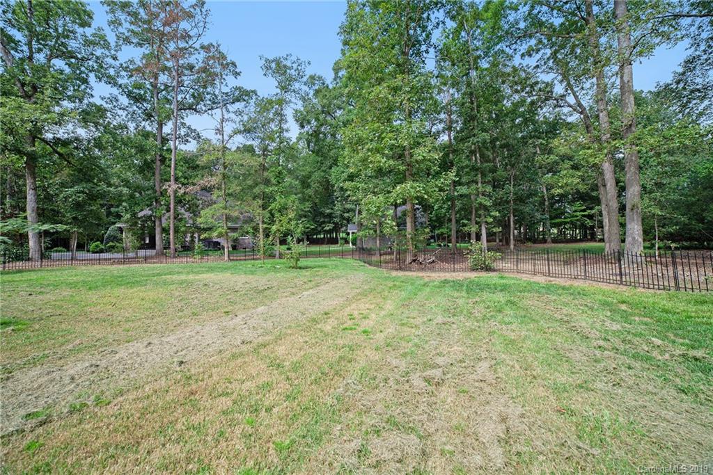 5415 Unionville Road Monroe, NC 28110 - Photo 36 of 40 a backyard of a house with lots of green space