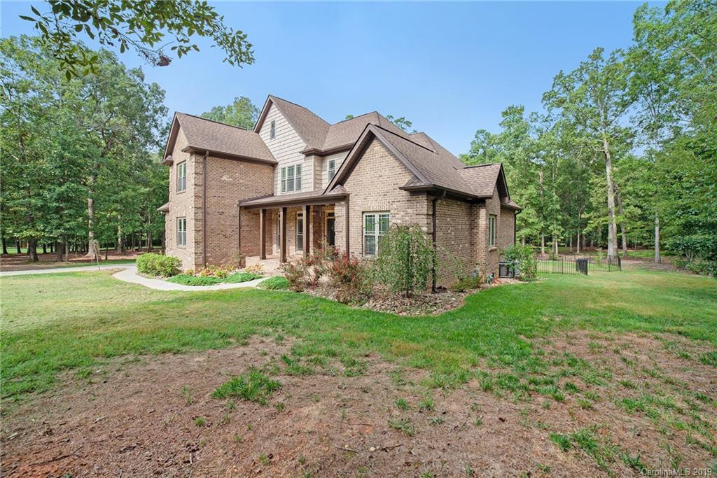 5415 Unionville Road Monroe, NC 28110 - Photo 39 of 40 a view of a house with yard and a garden