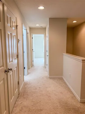 a view of a hallway with a room