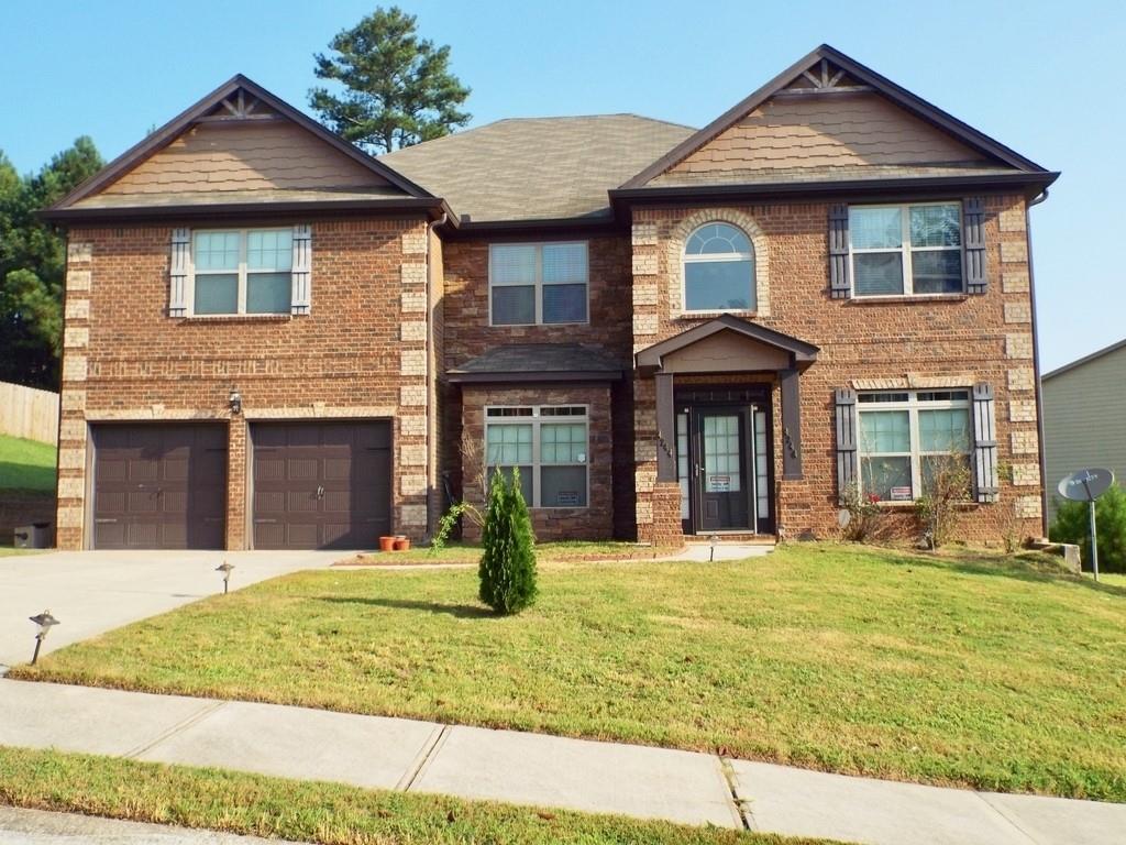 4244 Caveat Court Fairburn, GA 30213 - Photo 1 of 1 a front view of a house with a yard