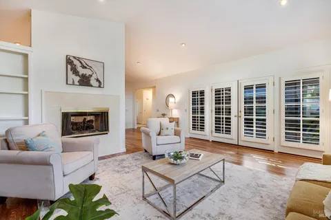 a view of a dining room with furniture and a fireplace