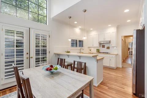 a kitchen with granite countertop cabinets and steel stainless steel appliances