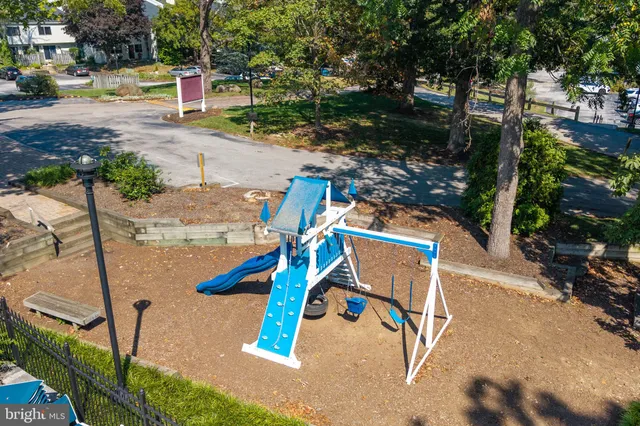 a view of a house with a snow on the road
