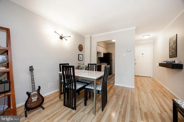 a view of a dining room with furniture and wooden floor