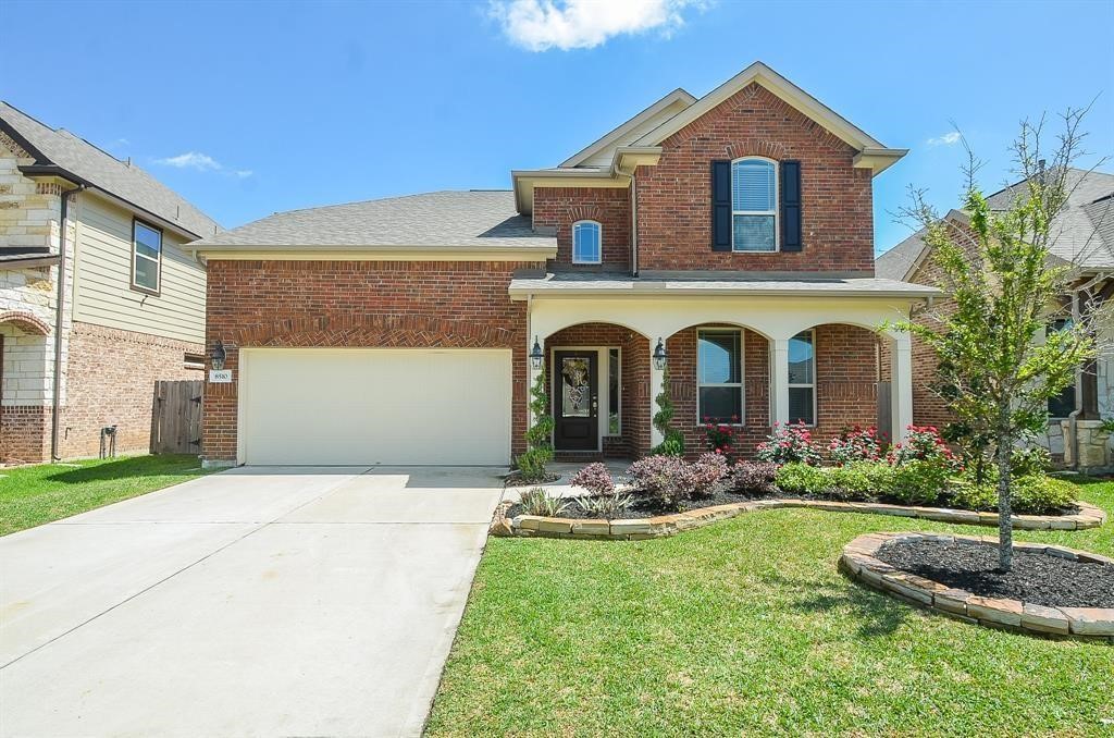 8510 Brinklow Point Drive Cypress, TX 77433 - Photo 2 of 46 a front view of a house with garden
