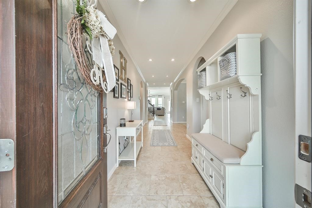 8510 Brinklow Point Drive Cypress, TX 77433 - Photo 4 of 46 a view of an entryway with wooden floor