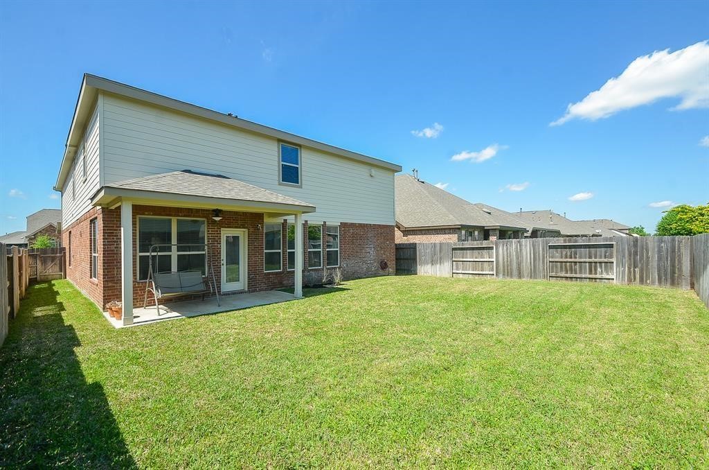 8510 Brinklow Point Drive Cypress, TX 77433 - Photo 42 of 46 a view of a house with a yard and sitting area