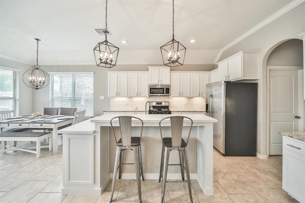 8510 Brinklow Point Drive Cypress, TX 77433 - Photo 8 of 46 a view of dining room and chandelier