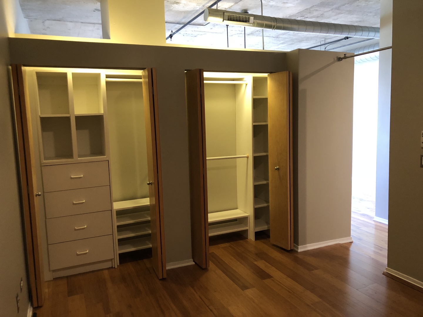6 South Laflin Street, Unit 604 Chicago, IL 60607 - Photo 13 of 17 a view of walk in closet with wooden floor