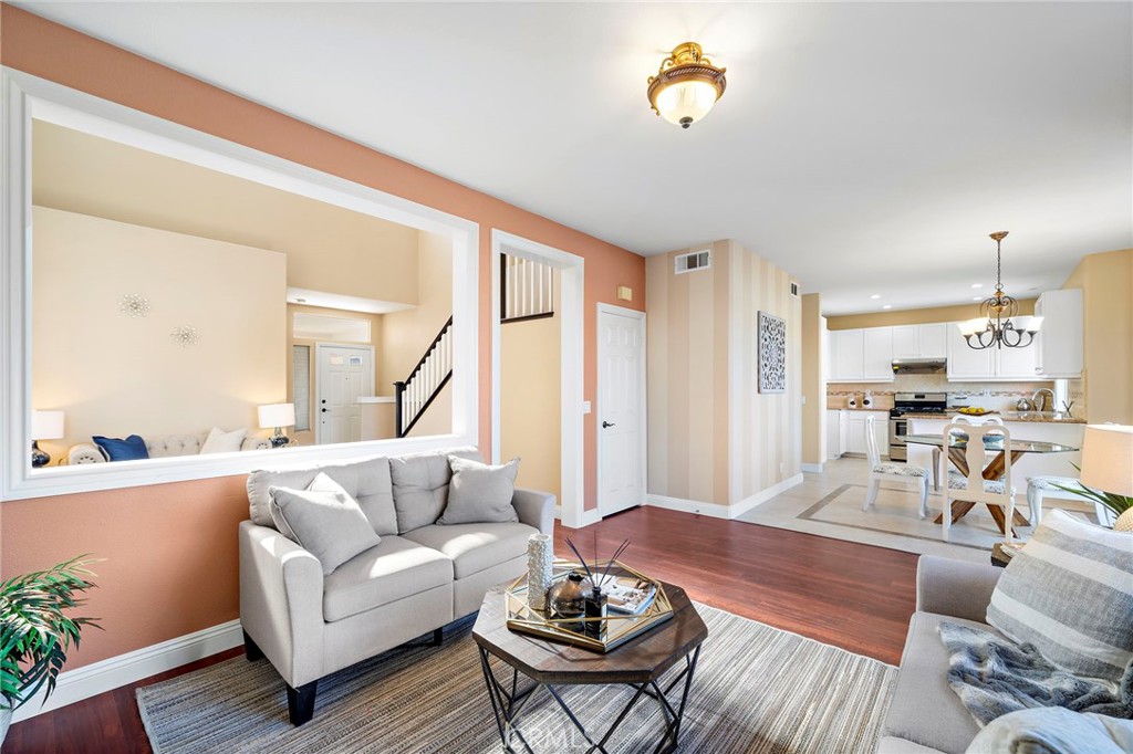 8971 Poinsettia Lane Garden Grove, CA 92841 - Photo 11 of 34 a living room with furniture and a table