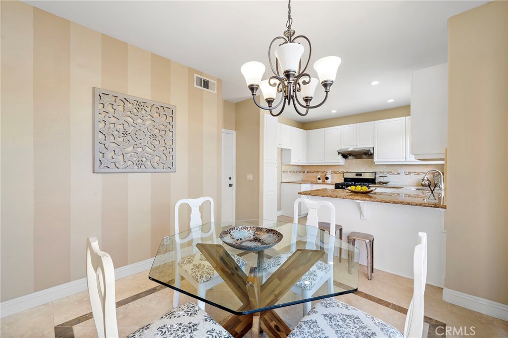 8971 Poinsettia Lane Garden Grove, CA 92841 - Photo 13 of 34 a view of a dining room with furniture