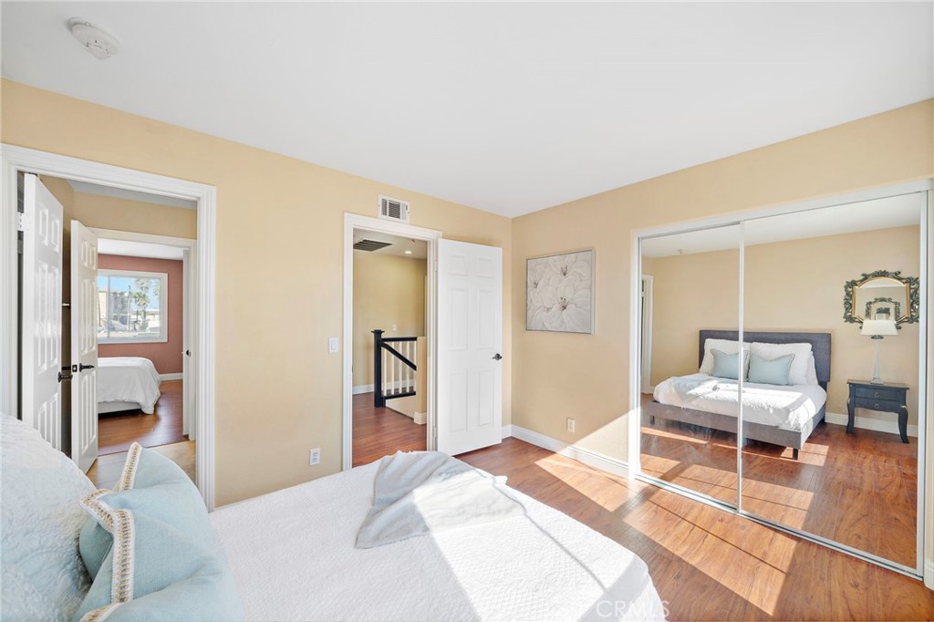 8971 Poinsettia Lane Garden Grove, CA 92841 - Photo 24 of 34 a bedroom with a bed and a chair with the view of bathroom
