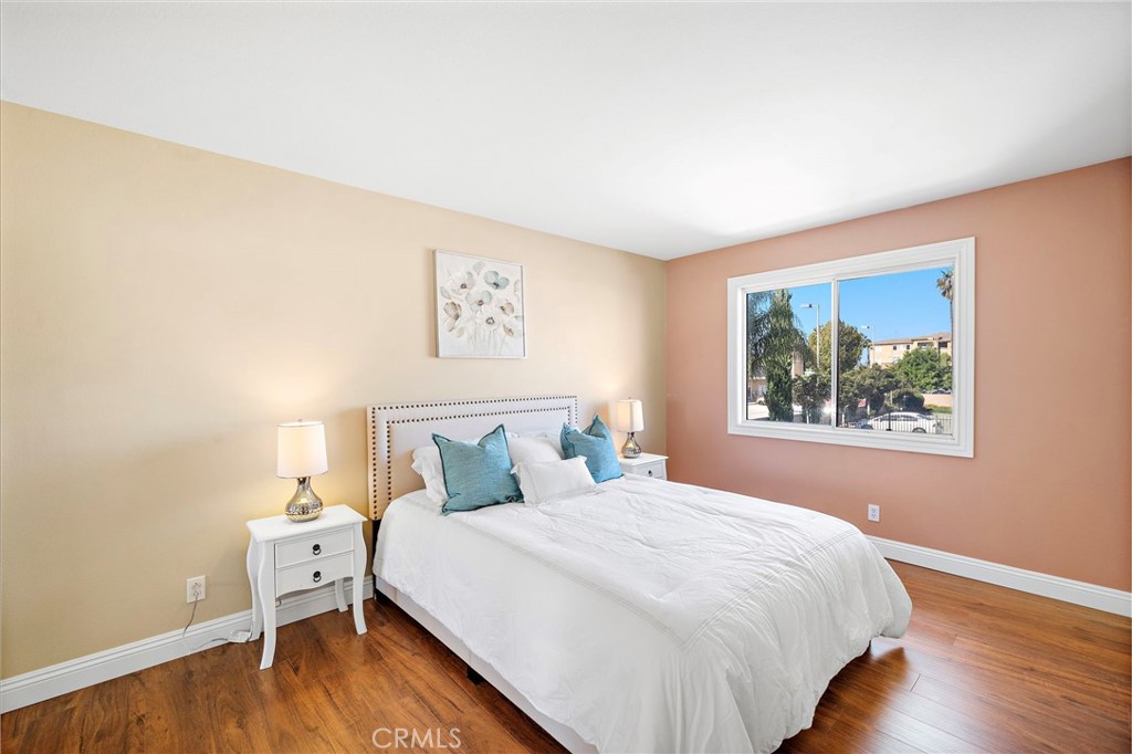 8971 Poinsettia Lane Garden Grove, CA 92841 - Photo 25 of 34 a bedroom with a bed and a window