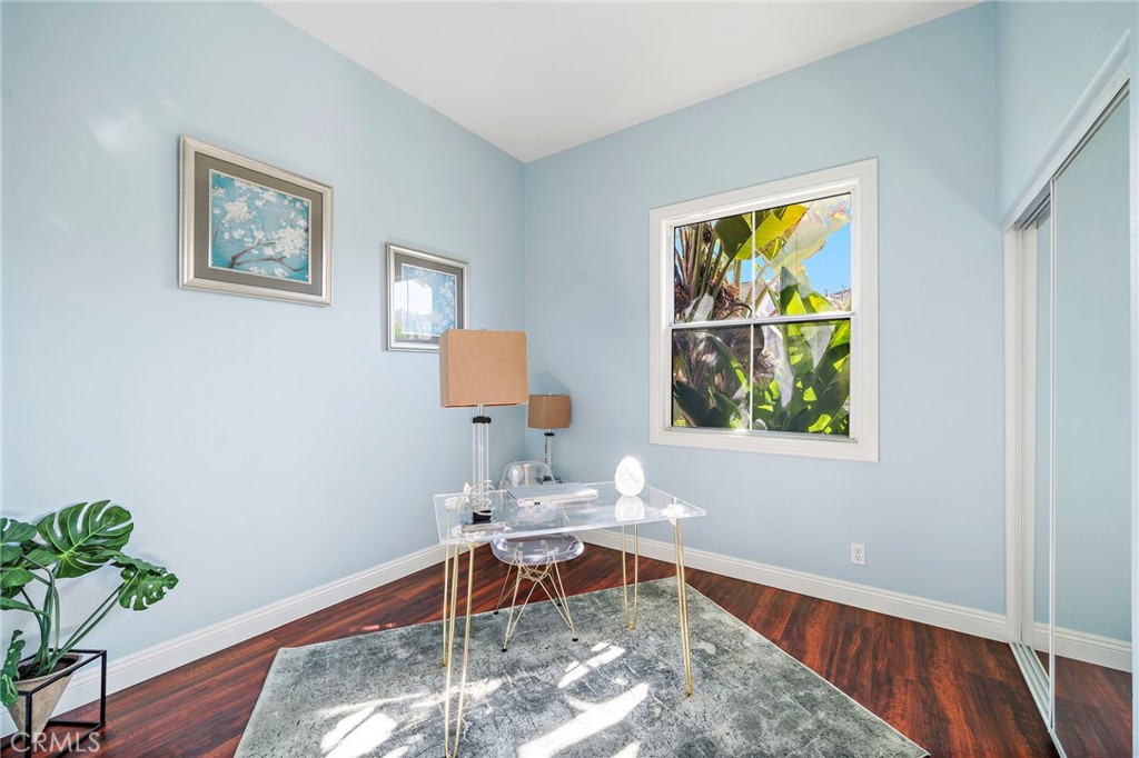 8971 Poinsettia Lane Garden Grove, CA 92841 - Photo 3 of 34 a living room with furniture and a window