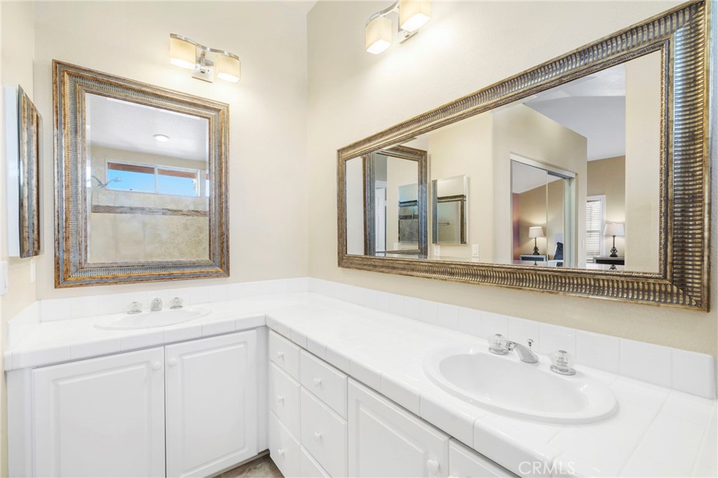 8971 Poinsettia Lane Garden Grove, CA 92841 - Photo 32 of 34 a bathroom with a sink and a mirror