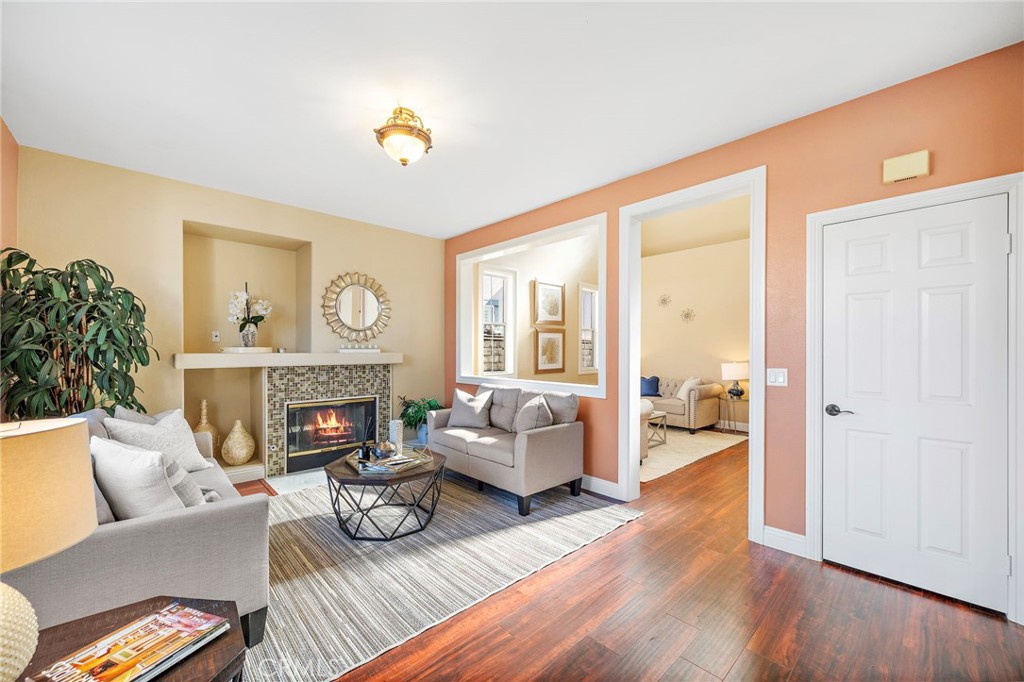8971 Poinsettia Lane Garden Grove, CA 92841 - Photo 9 of 34 a living room with furniture and a fireplace