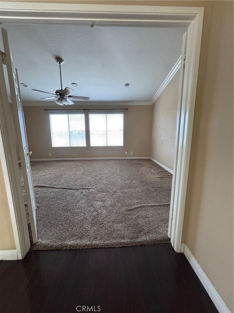 17092 Whispering Brook Way Riverside, CA 92503 - Photo 18 of 74 a view of empty room with wooden floor and fan