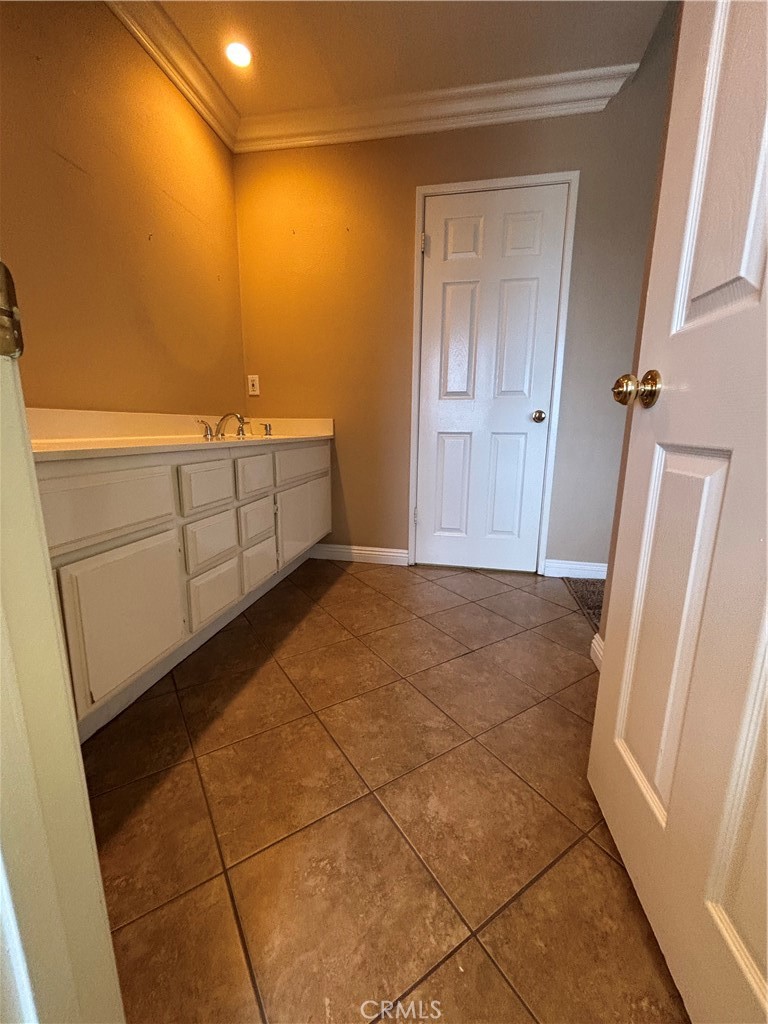 17092 Whispering Brook Way Riverside, CA 92503 - Photo 32 of 74 a bathroom with a sink a toilet and mirror