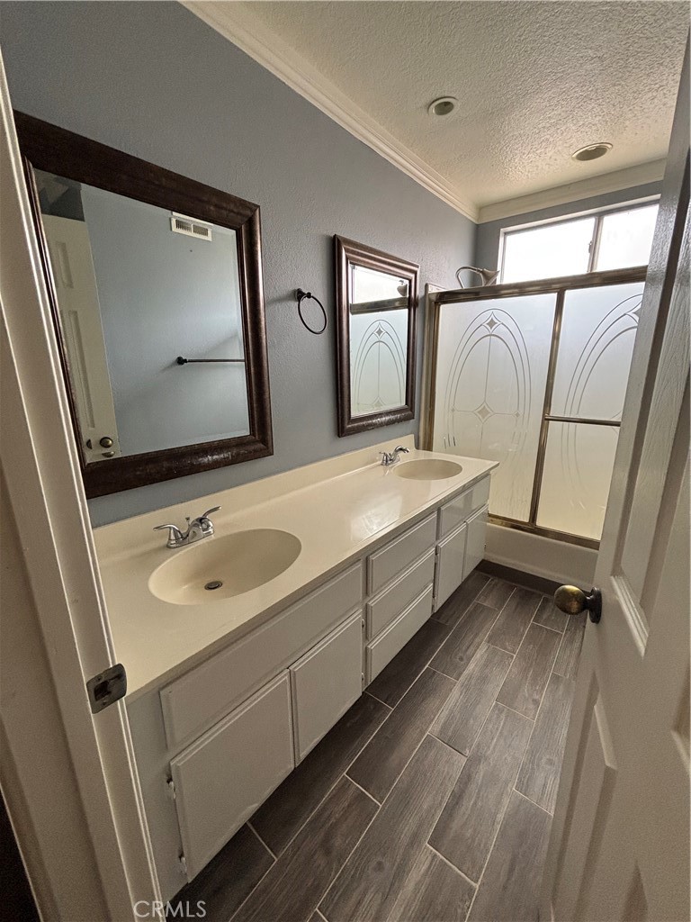 17092 Whispering Brook Way Riverside, CA 92503 - Photo 33 of 74 a bathroom with a double vanity sink and mirror