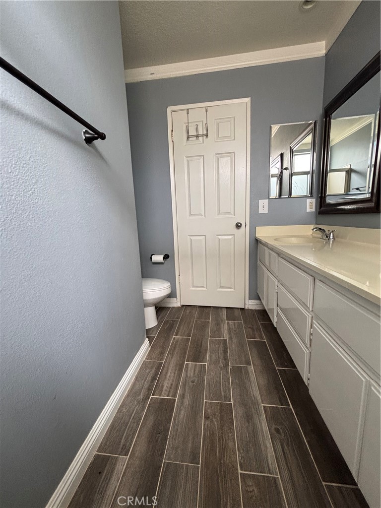 17092 Whispering Brook Way Riverside, CA 92503 - Photo 34 of 74 a bathroom with a sink and a mirror