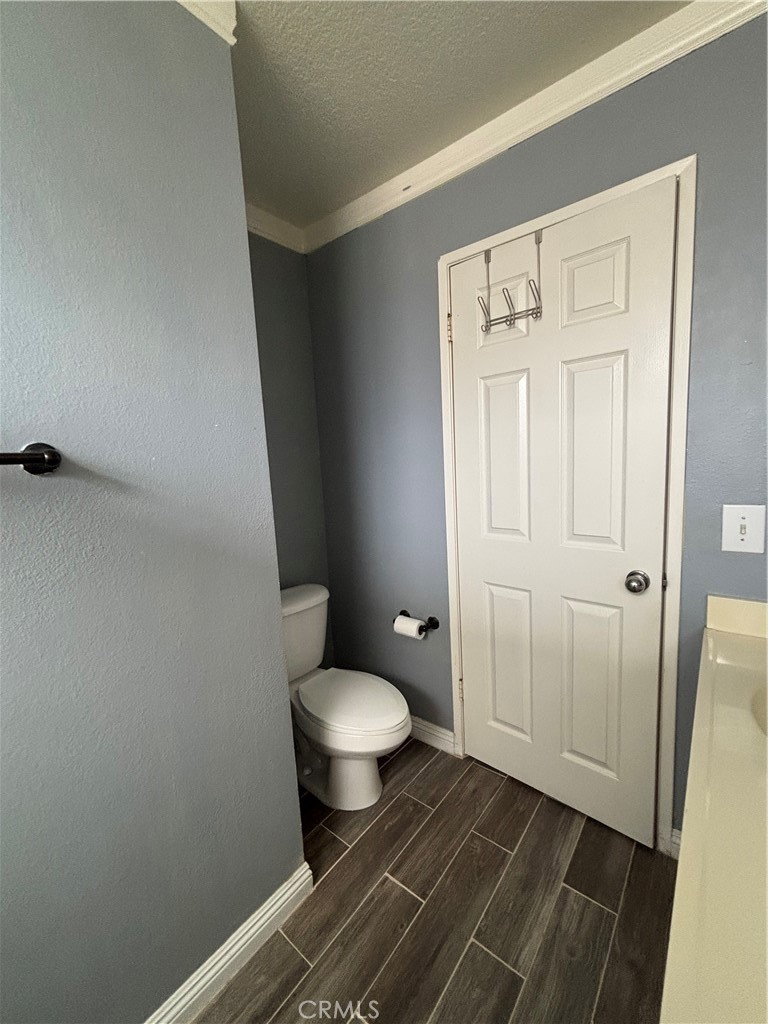 17092 Whispering Brook Way Riverside, CA 92503 - Photo 38 of 74 a bathroom with a sink and a toilet