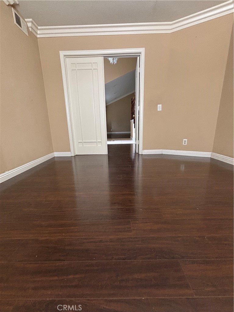 17092 Whispering Brook Way Riverside, CA 92503 - Photo 4 of 74 a view of an empty room with wooden floor