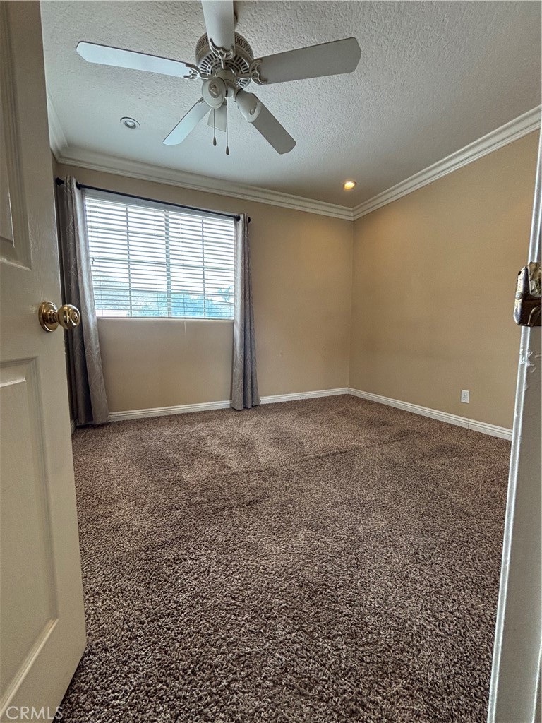 17092 Whispering Brook Way Riverside, CA 92503 - Photo 42 of 74 a view of room with window and ceiling fan