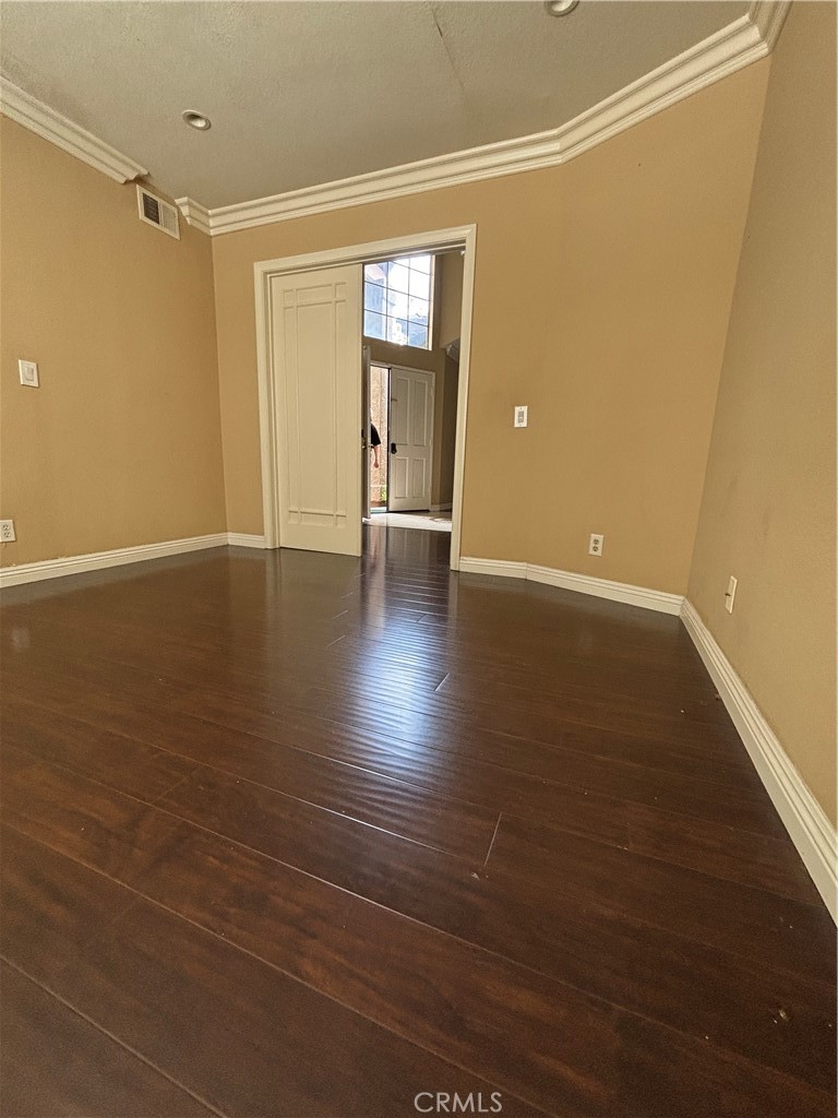 17092 Whispering Brook Way Riverside, CA 92503 - Photo 5 of 74 wooden floor in an empty room with a window