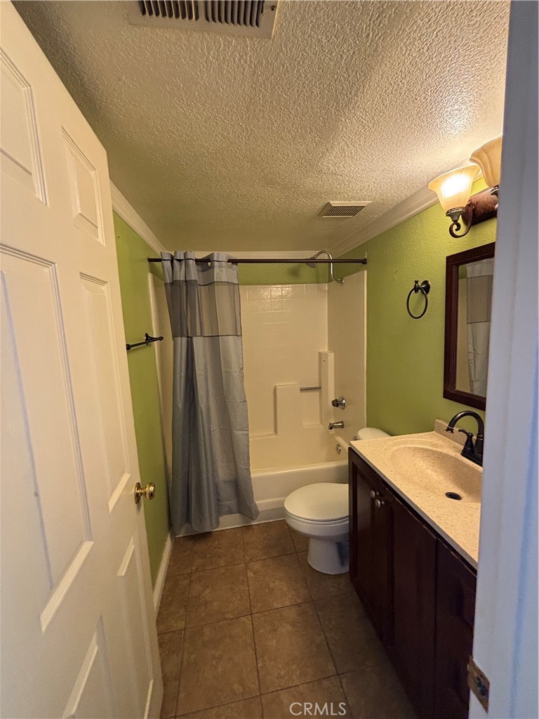 17092 Whispering Brook Way Riverside, CA 92503 - Photo 53 of 74 a bathroom with a granite countertop sink toilet and shower