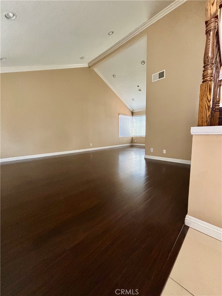 17092 Whispering Brook Way Riverside, CA 92503 - Photo 9 of 74 a view of a hallway with wooden floor