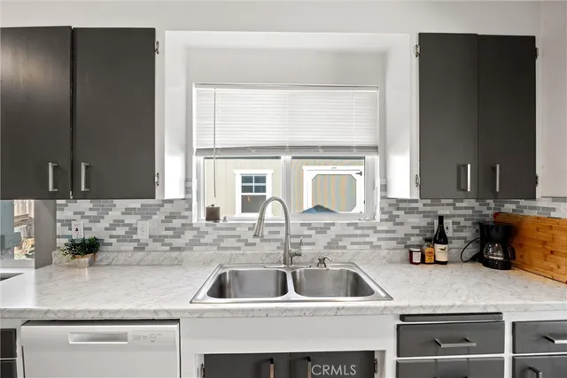 a kitchen with a stove and a refrigerator