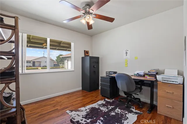 a view of a patio with table and chairs and wooden floor