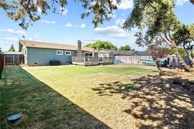 a view of a swimming pool with a yard