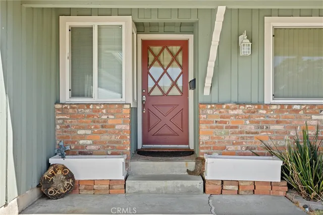 a living room with furniture a rug and a chandelier