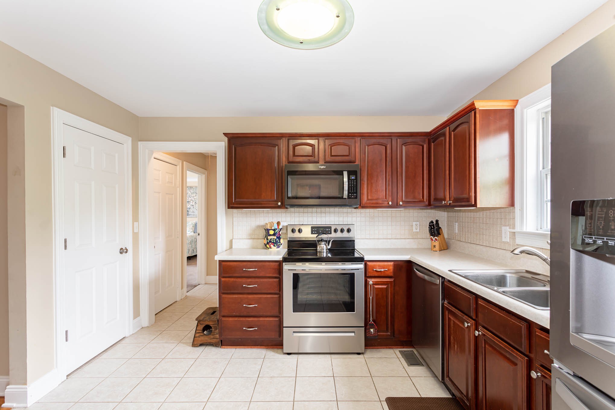 817 Blakemore Road Dickson, TN 37055 - Photo 11 of 30 a kitchen with stainless steel appliances granite countertop a stove and a sink
