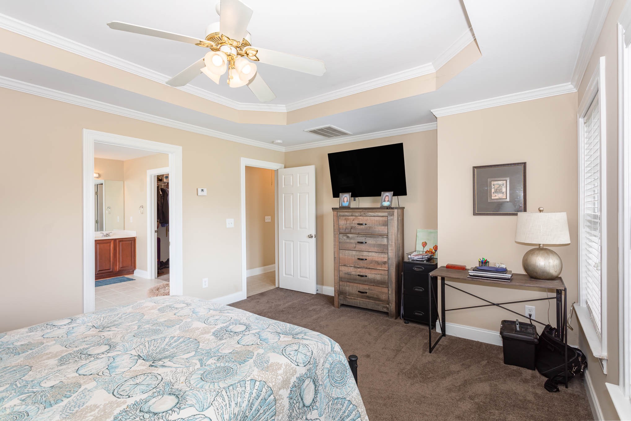 817 Blakemore Road Dickson, TN 37055 - Photo 14 of 30 a bedroom with a bed and a flat screen tv