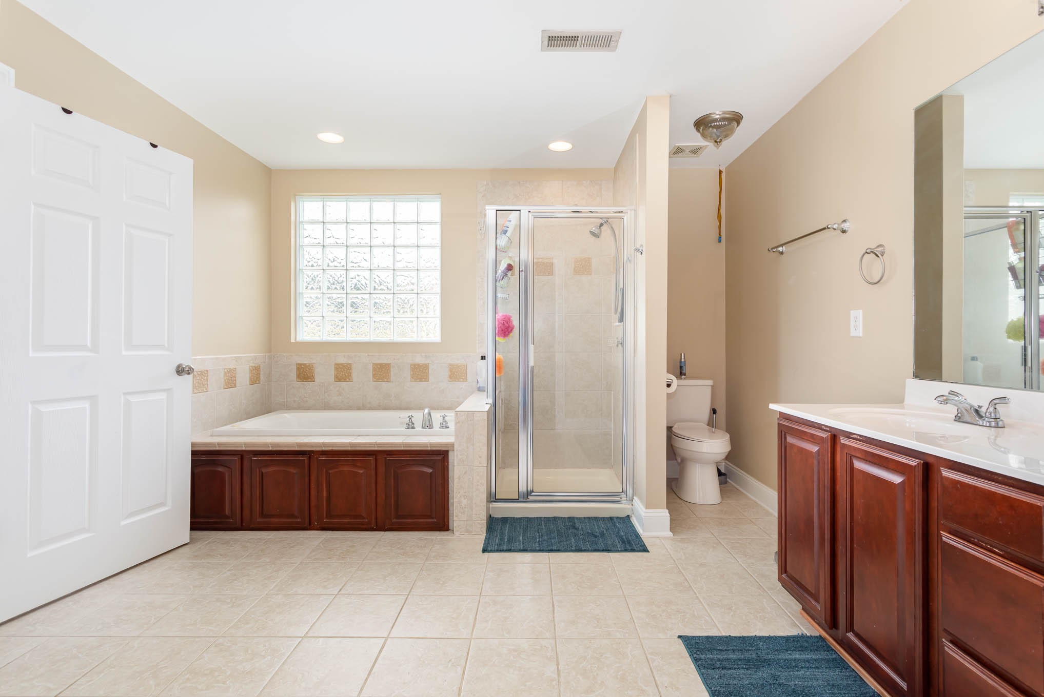 817 Blakemore Road Dickson, TN 37055 - Photo 16 of 30 a spacious bathroom with a bathtub sink mirror vanity and toilet