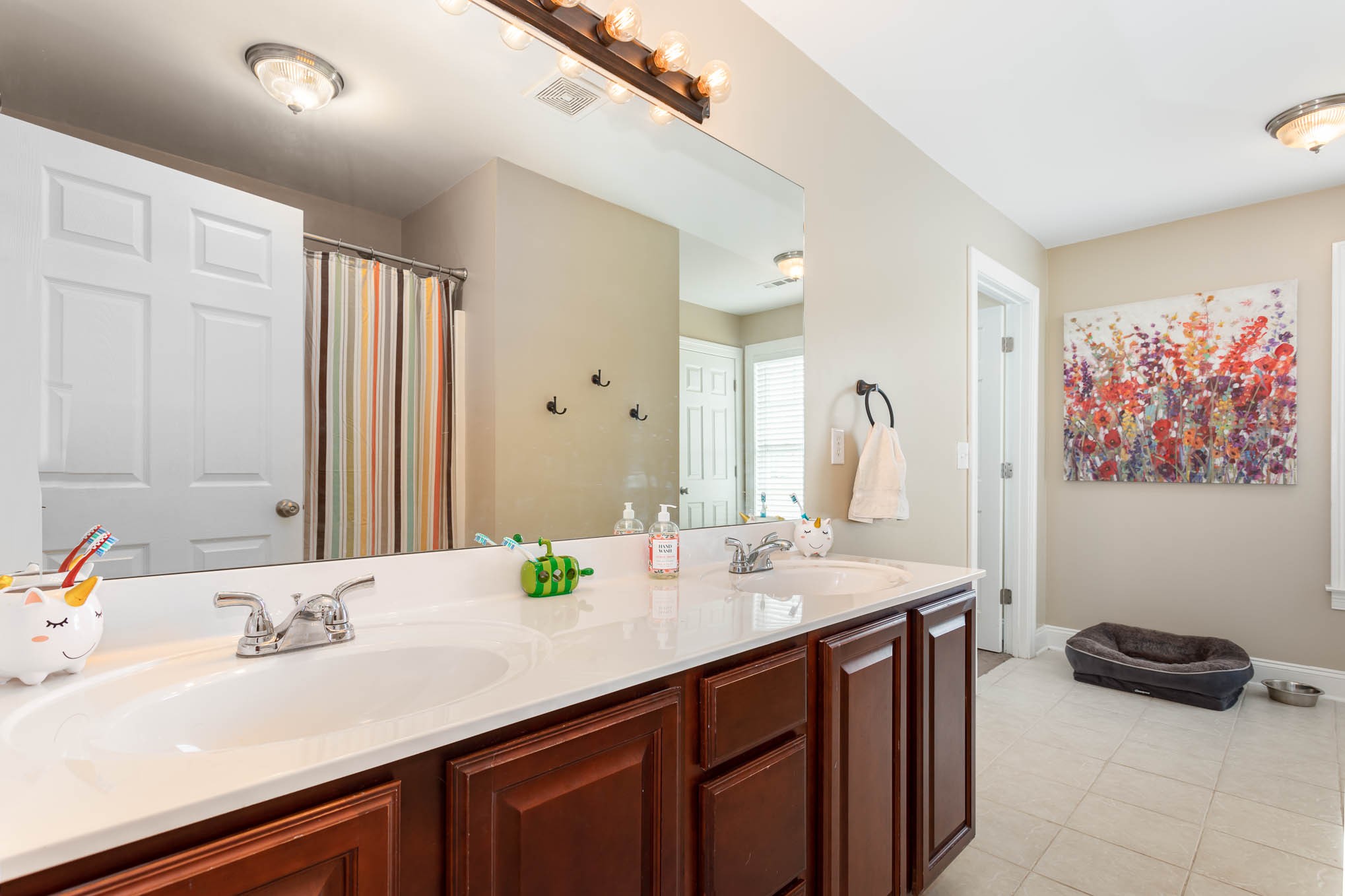 817 Blakemore Road Dickson, TN 37055 - Photo 19 of 30 a bathroom with a sink double vanity and a mirror