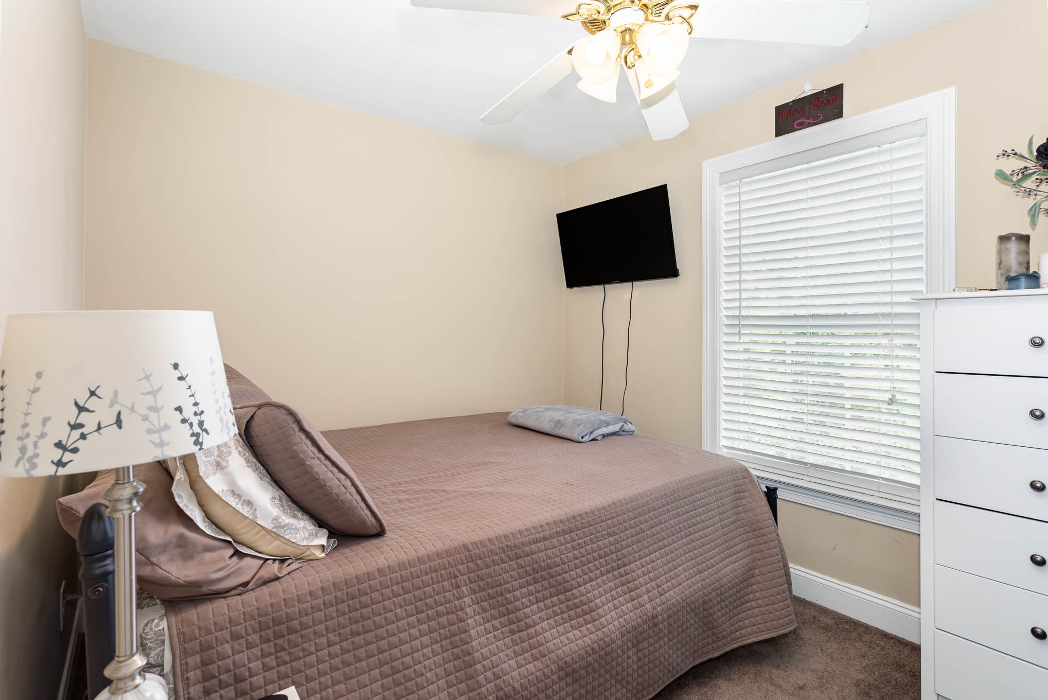 817 Blakemore Road Dickson, TN 37055 - Photo 21 of 30 a bedroom with a bed and a flat screen tv