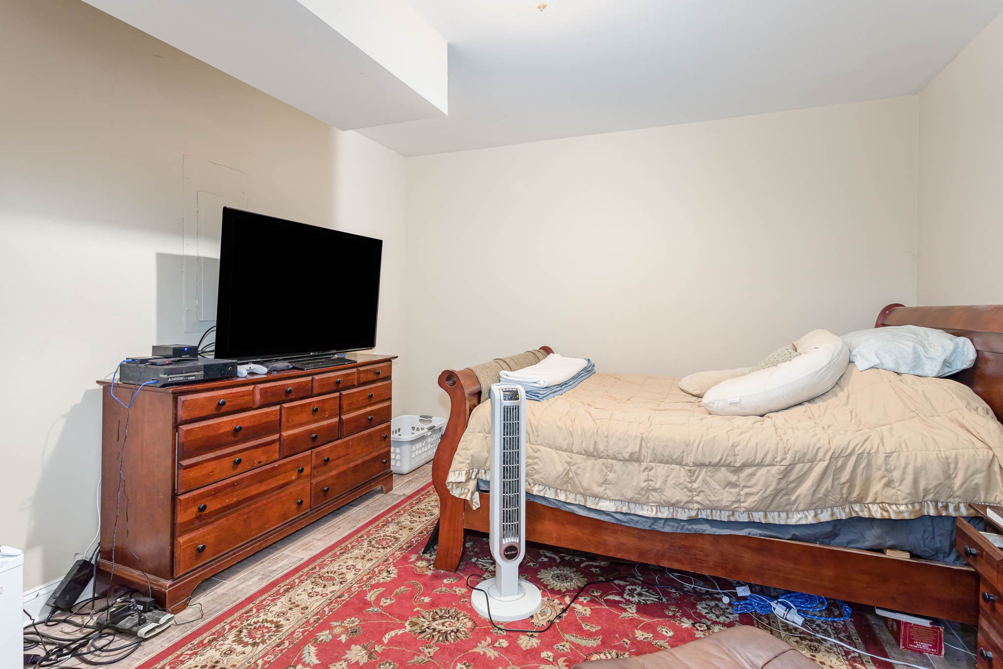 817 Blakemore Road Dickson, TN 37055 - Photo 25 of 30 a bedroom with a bed and flat screen tv