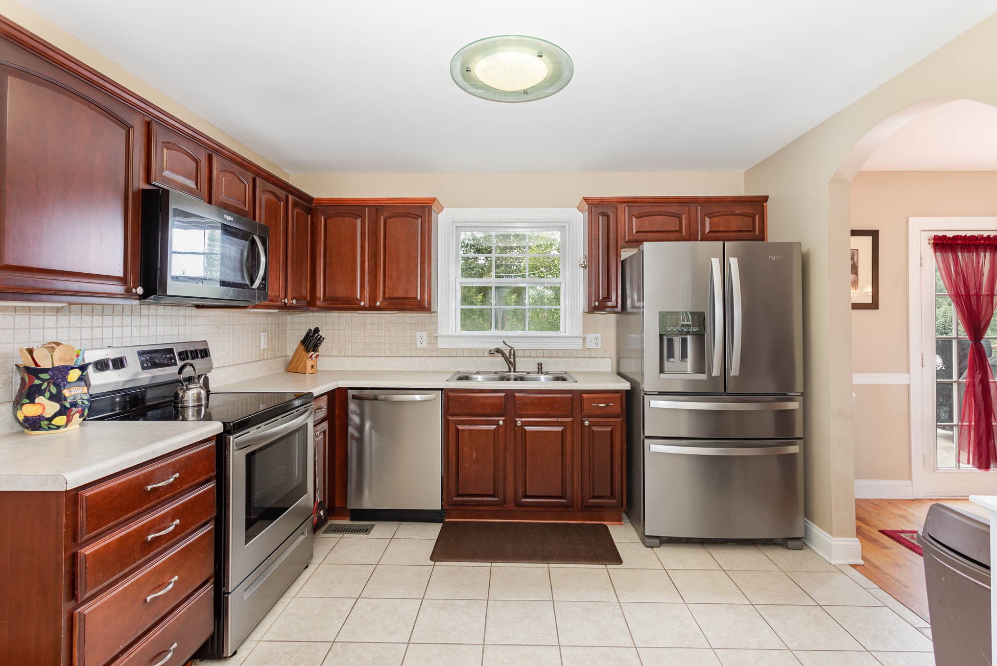 817 Blakemore Road Dickson, TN 37055 - Photo 10 of 30 a kitchen with stainless steel appliances granite countertop a stove top oven a sink and dishwasher